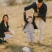 photo of family having fun with soccer ball